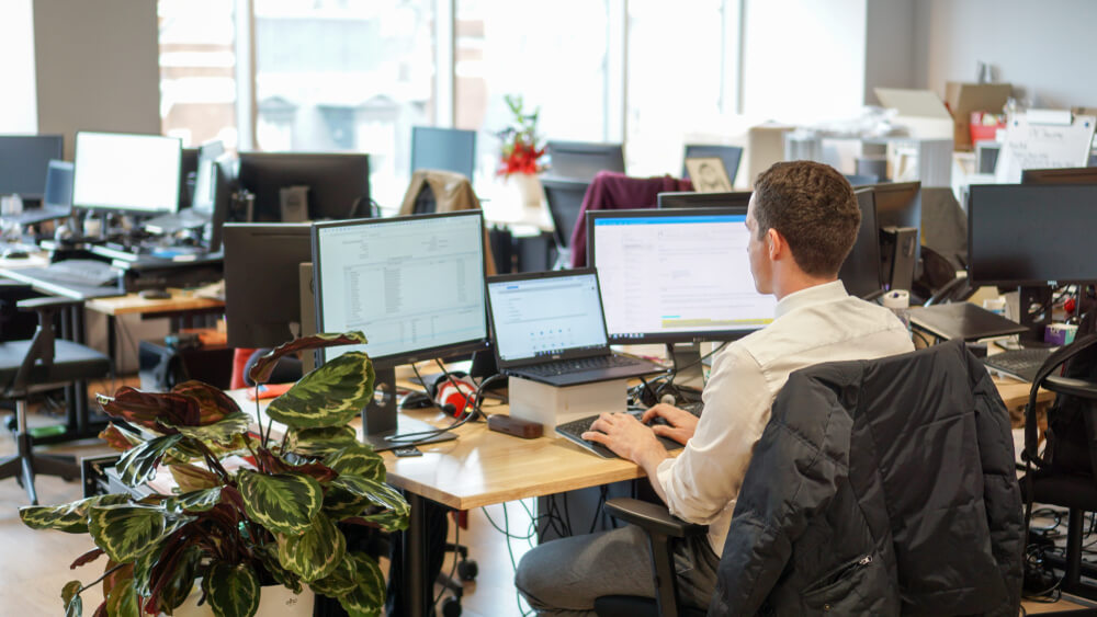propco-person-on-desk-working