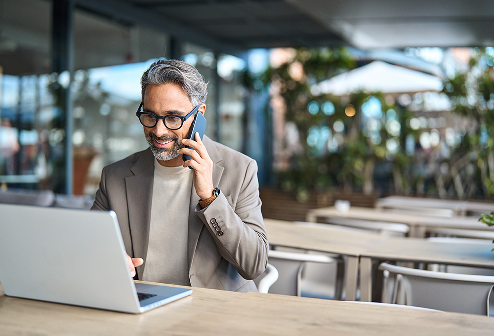 Middle,Aged,Business,Man,Talking,On,Mobile,Phone,Hybrid,Working